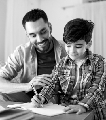 Dad helping son with homework