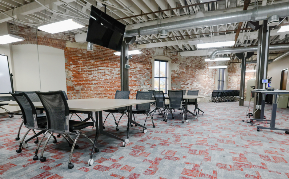 Large classroom with table and chairs