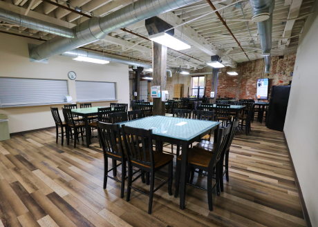The Hangout: A large open room with tables and chairs